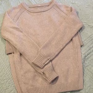 Grey cotton LuluLemon sweater. Middle is color